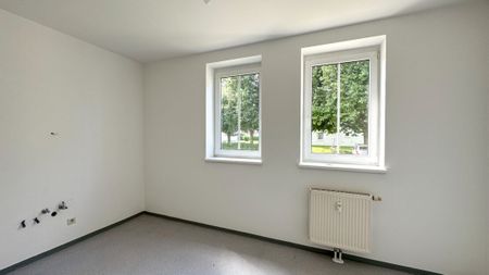 Helle Erdgeschosswohnung mit charmanter Freifläche - Foto 3