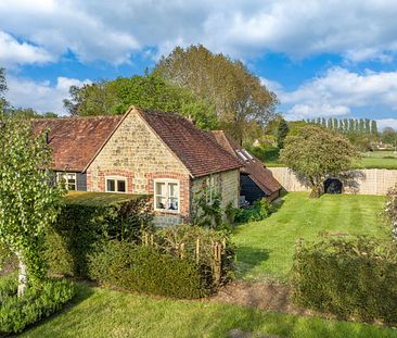 A three bedroom cottage in a fantastic village location with impressive countryside views and south facing private garden. - Photo 3