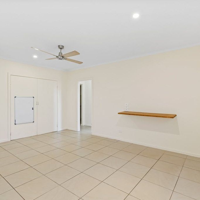 COMFORTABLE FAMILY HOME WITH LARGE YARD - Photo 1