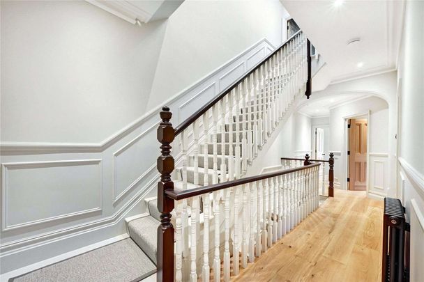 Welcome to this exquisitely refurbished five bedroom semi-detached family home, meticulously designed to an exceptionally high standard. - Photo 1