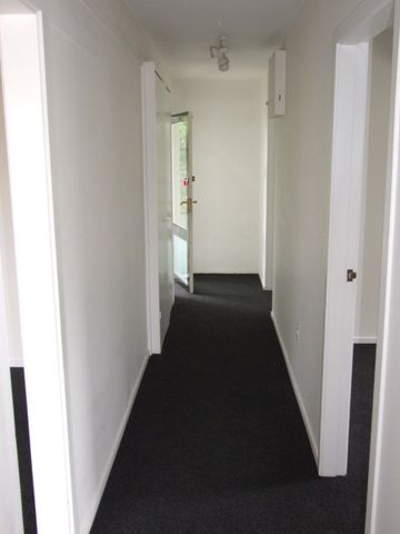 Sunny 2-Bedroom Upstairs Unit with Modern Amenities and Garage! - Photo 2