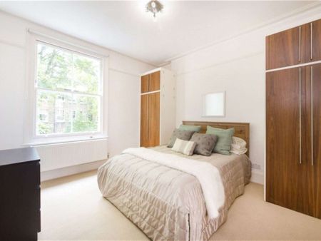 A modern first floor one bedroom apartment with wooden floors in the reception room. - Photo 4