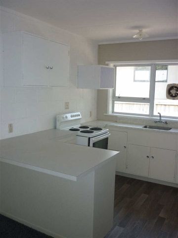 Completely redecorated, roomy, two bedroom unit situated in a quiet cul-de-sac. - Photo 2