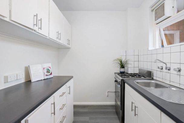 Spacious and sunlit in a sought-after street - Photo 1