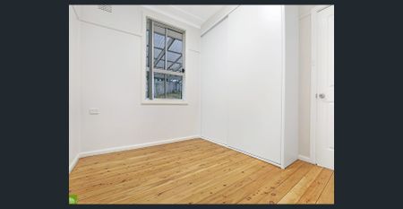 Renovated Home with Lawn Maintenance Included! - Photo 4