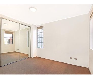 Refined Coastal Living in a Sun-Filled Two-Bedroom Apartment - Photo 6