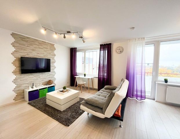 Modernes City-Apartment mit atemberaubender Skyline & Parkblick - Photo 1