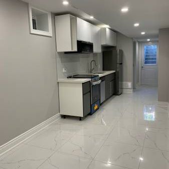 High Ceiling basement apartment -utilities included - Photo 3