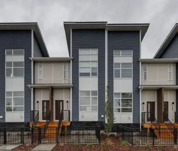 Brand New Upgraded 3 Bedroom Townhome with Double Garage Across Green Space | 124 Walden Lane Southeast, Calgary - Photo 1