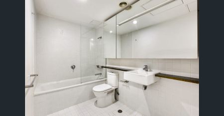 Contemporary 1-Bedroom with Balcony & Floor-to-Ceiling Windows - Photo 4