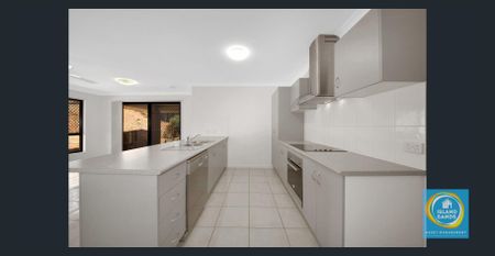 MODERN ELEVATED 4 BEDROOM, 2 BATHROOM HOME - Photo 2