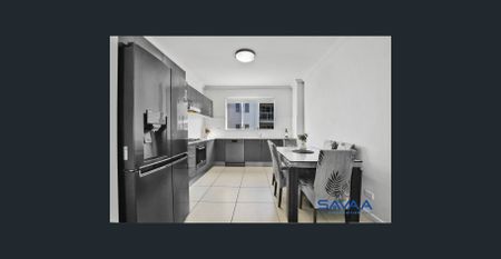 Spacious 2-Bed Retreat with Modern Comforts & Prime Location! - Photo 2