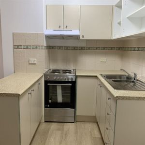 A Quiet Sanctuary Away from The Bustle of The Inner-City with New Flooring, New Paint and New Cooking Appliance. - Photo 2