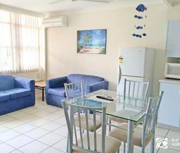 Furnished 2-bedroom unit with air conditioning and water included - Photo 1