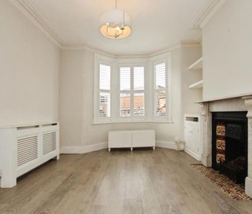 A pet-friendly mid-terraced three bedroom family home located withi... - Photo 2