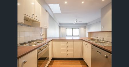 TOP FLOOR SPLIT LEVEL APARTMENT - Photo 4