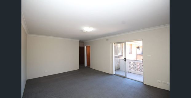 ONE WEEKS RENT FREE - MOVE IN BEFORE XMAS - TOP FLOOR TWO BEDROOM UNIT WITH GARAGE - Photo 1