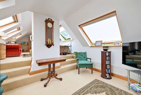 A beautifully presented, fully furnished two-bedroom top-floor apartment, combining character, contemporary loft-style living and exceptional proportions, with stunning views to the rear. - Photo 3