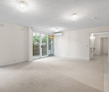 Superbly Located Two Bedroom Apartment With Parking For One Car! - Photo 1