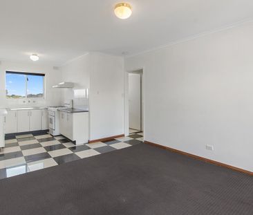 Stylish Top Floor Unit With Great Views Just Minutes from the City! - Photo 1