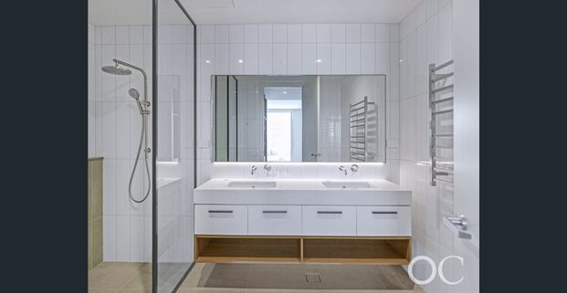 Open the Door to Luxurious Sub-Penthouse Living with Panoramic Coastal and River Views - Photo 1