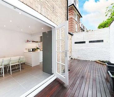 This four bedroom townhouse is tucked away on a quiet street moments from the amenities of the Kings Road. - Photo 3