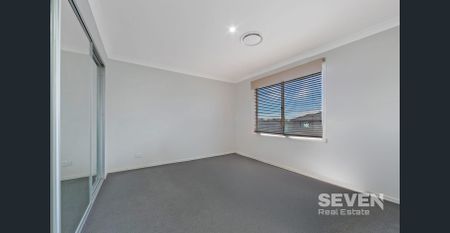 Spacious Family Haven in a Peaceful Neighbourhood - Photo 4