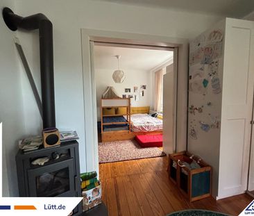 Charmante 3-Zimmer-Wohnung mit Kamin & Gartenanteil in Kiel-Hassee - Foto 1