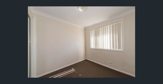 Spacious Three-Bedroom Unit in Prime Position - Photo 1