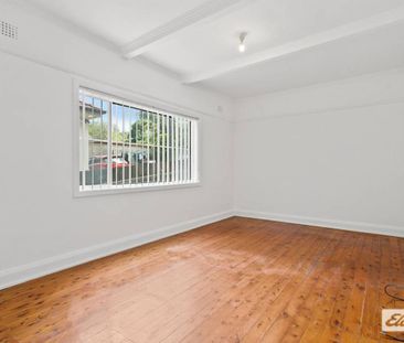 Neat & Tidy Family Home | Split-Level Living in Prime Location - Photo 2