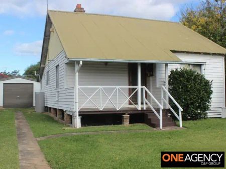 “A Charming 2‑Bed Cottage with Polished Floors & Sunlit Sunroom” - Photo 5
