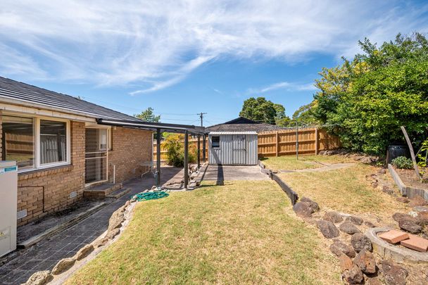 Charming Three-Bedroom Home - Photo 1