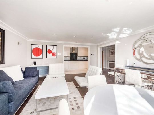 A spacious two bedroom apartment in Harrods Village with resident gym and pool facilities plus an allocated private parking space - Photo 1