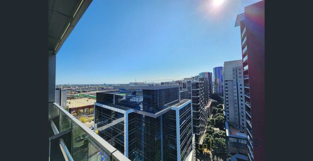 Furnished High-Floor 2BR Apartment with Sunlit Living & Luxury Amenities - Photo 1