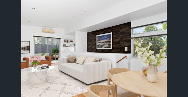 Modern Two-Bedroom Townhouse with Balcony and Secure Garage - Photo 1