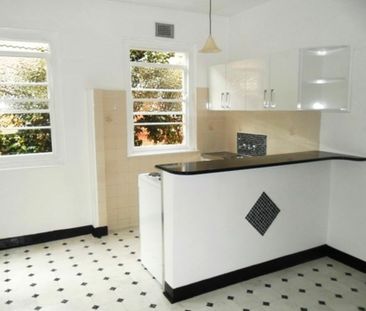 Three Bed Unit in Convenient Location - Photo 1