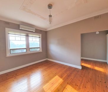 One Bedroom Upstairs Apartment Oozing Charm and Style - Photo 1