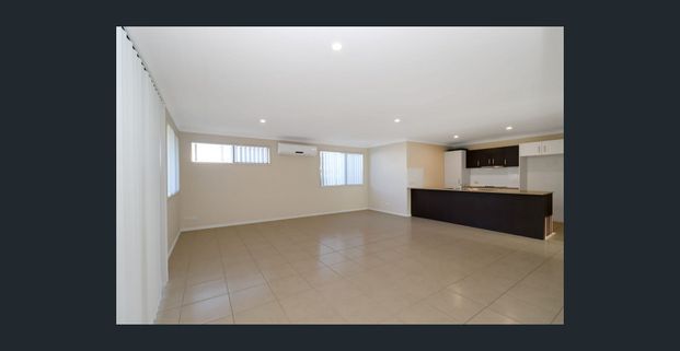Beautifully presented 4 Bedroom home with an Extra Large Living Area - Photo 1