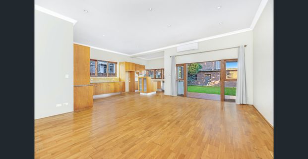 Spacious Four-Bedroom Family Home with Large Backyard - Photo 1