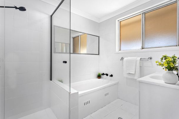 RENOVATED AND READY TO MOVE IN Three Bedroom Residence Close to All Amenities! - Photo 1