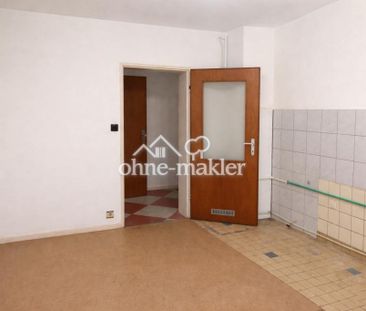 Renovierungsbedürftige Erdgeschosswohnung mit Balkon und Garage in ... - Foto 1