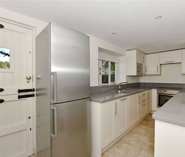 A stunning character cottage in an idyllic village setting - Photo 1