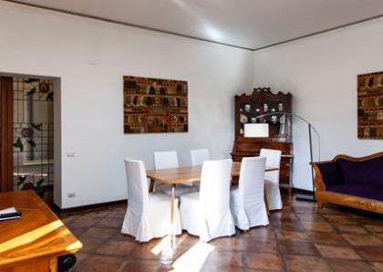 Attic-Monti: 1-6 month rentals. Spacious, furnished 3 Bedroom, 2 bath, living room, dining room, study and large panoramic terrace. Bright, silent, located in well kept Palazzo d’Epoca with elevator and doorman. Near transport and Metro.