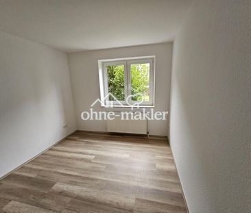 Gepflegte 4-ZKB im EG mit großer Südterrasse, EBK und Stellplatz - Photo 2