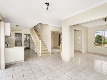 Spacious Four-Bedroom Home with Private Yard & Versatile Living - Photo 2