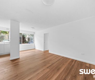 Renovated Full-Brick Unit in Prime Location - Photo 5