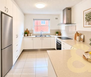 Sunny Two-Bedroom Unit - Photo 4