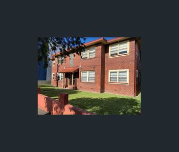 -Centrally located large two bedroom unit with sun room. - Photo 6