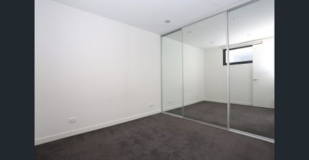 Modern top floor apartment set in secure complex - Photo 2