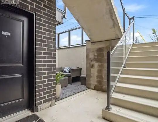 111 - 6065 MCLEOD ROAD — 1 Bedroom - Photo 1
